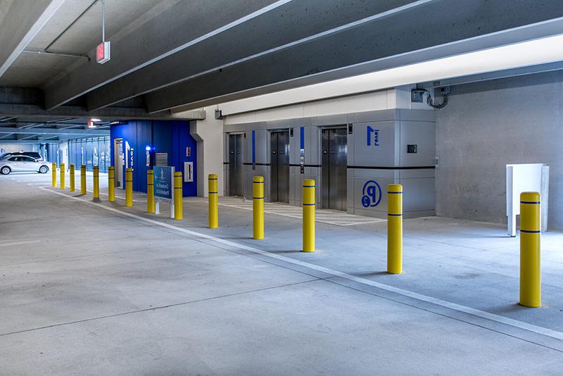 Photo of the elevators and signs within the Baptist Medical center parking structure